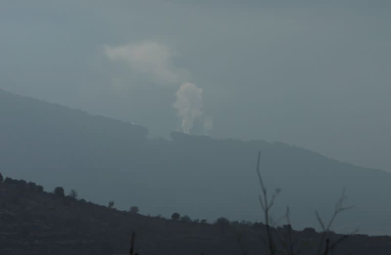 Smoke rises from Halta village as seen from Ibl al-Saqi village in southern Lebanon