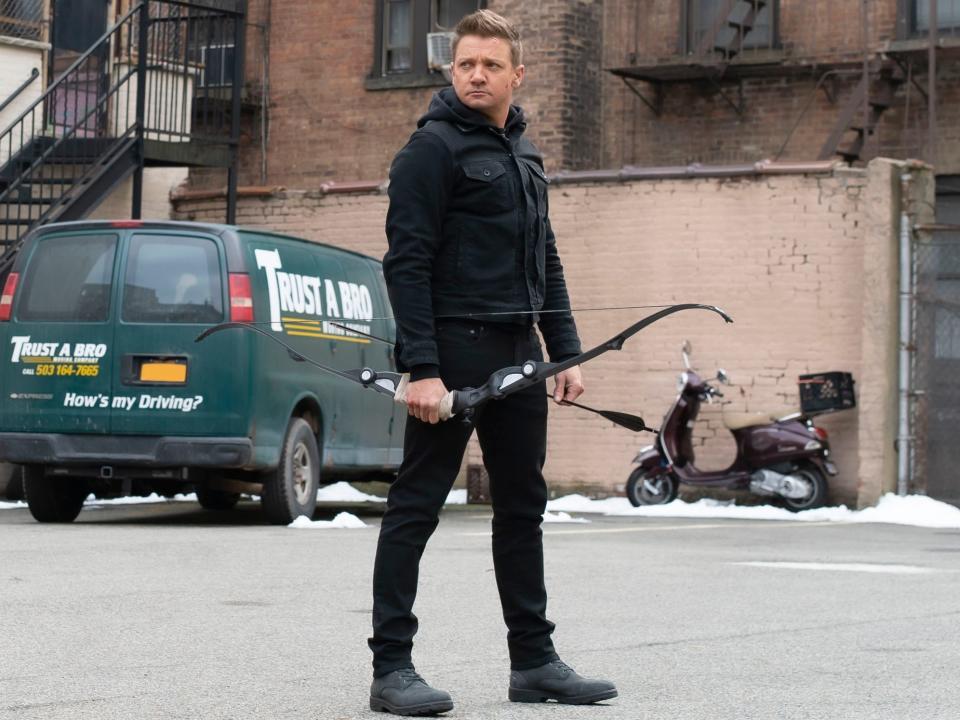 Jeremy Renner holding a bow and arrow on "Hawkeye."