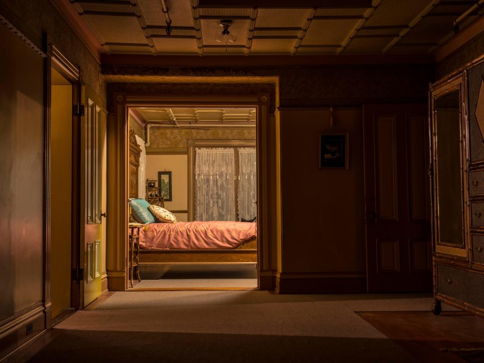 the oriental bedroom at the winchester mansion with a bed in the background