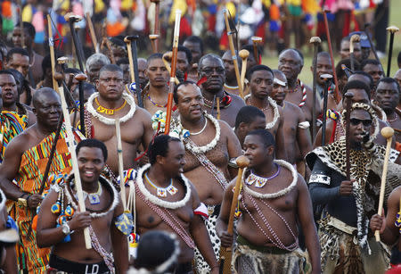 FILE PHOTO: Swaziland's King Mswati III (C) arrives with his regiments after maidens delivered reeds at Ludzidzini royal palace during the annual Reed Dance in Swaziland, August 30, 2015. REUTERS/Siphiwe Sibeko/File Photo