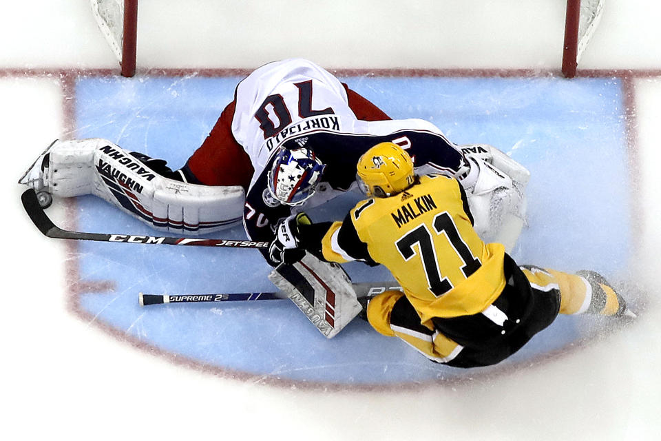 Pittsburgh Penguins' Evgeni Malkin (71) can't get a shot past Columbus Blue Jackets goaltender Joonas Korpisalo during the second period of an NHL hockey game in Pittsburgh, Thursday, March 7, 2019. The Penguins won 3-0. (AP Photo/Gene J. Puskar)