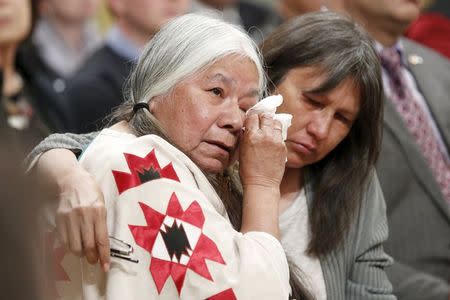 Attendees embrace during the Truth and Reconciliation Commission of Canada closing ceremony at Rideau Hall in Ottawa June 3, 2015. REUTERS/Blair Gable