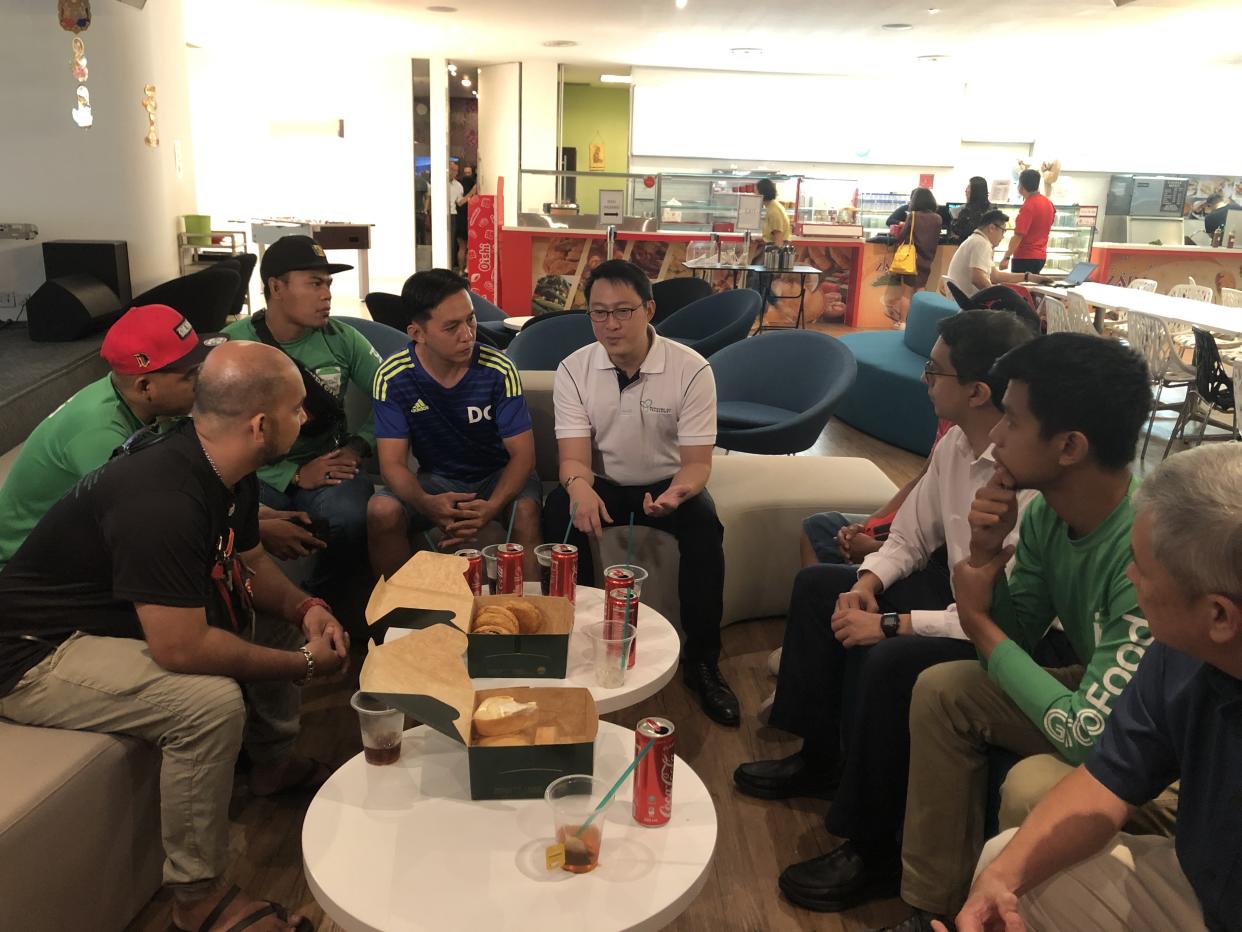 Senior Minister of State Lam Pin Min speaks to food delivery riders at the Land Transport Authority headquarters on 8 November, 2019. (Yahoo News Singapore file photo)