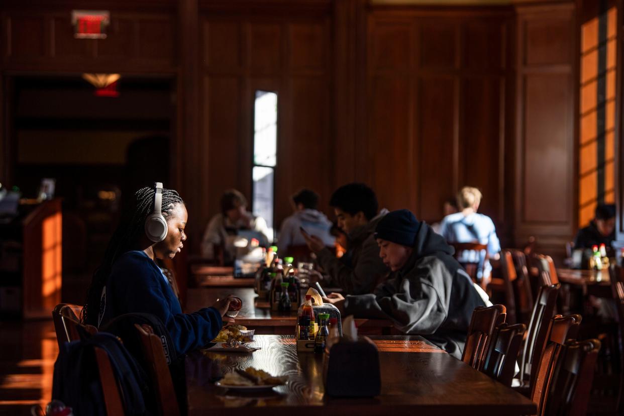 Bopo Taiwo adds hot sauce to her breakfast inside the E. Bronson Ingram dinning hall at Vanderbilt University in Nashville, Tenn., Monday, Nov. 27, 2023.