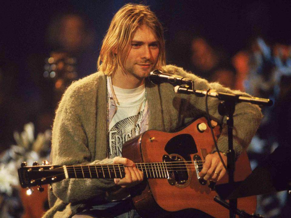 <p>Frank Micelotta/Getty </p> Kurt Cobain performs with his group Nirvana at a taping of the television program 