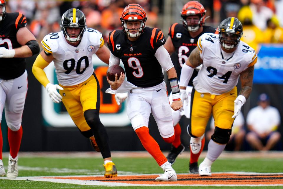 Cincinnati Bengals quarterback Joe Burrow (9) runs for a first down during the fourth quarter of a Week 1 NFL football game against the Pittsburgh Steelers, Sunday, Sept. 11, 2022, Paycor Stadium in Cincinnati. Mandatory Credit: Sam Greene-USA TODAY Sports