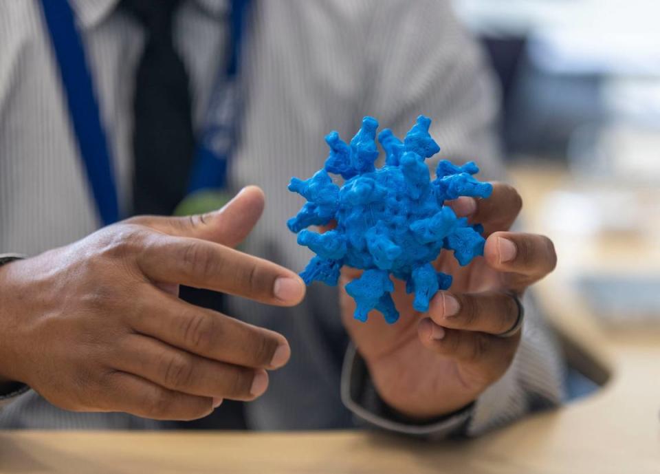Kevin O. Saunders, PhD, Director of Research for the Duke Human Vaccine Institute, uses a model of the SARS-CoV-2 virus to explain how his department is working on vaccines during an interview in is office at the Duke University Human Vaccine Institute on Wednesday, July 13, 2022 in Durham, N.C.