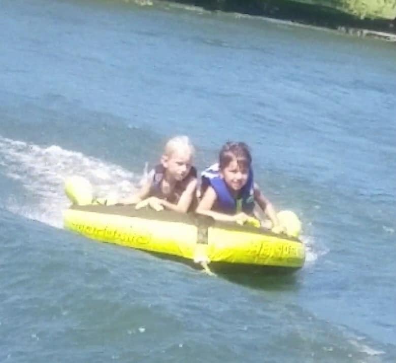 Andrew Brady on a water donut with one of his brothers.