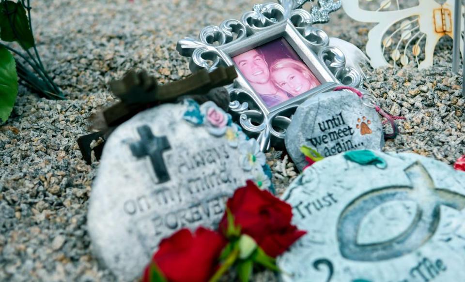 Pictured is a framed photo of Mallory Beach with her boyfriend, Anthony Cook, memorial stones and red roses set out for Valentines Day as seen at her gravesite on Friday, Feb. 21, 2020, in Sandy Run Cemetery near Varnville in Hampton County, South Carolina. Beach, 19, was killed in a boat accident in Archers Creek in Beaufort County on Feb. 24, 2020, when the boat she was in struck a bridge piling.