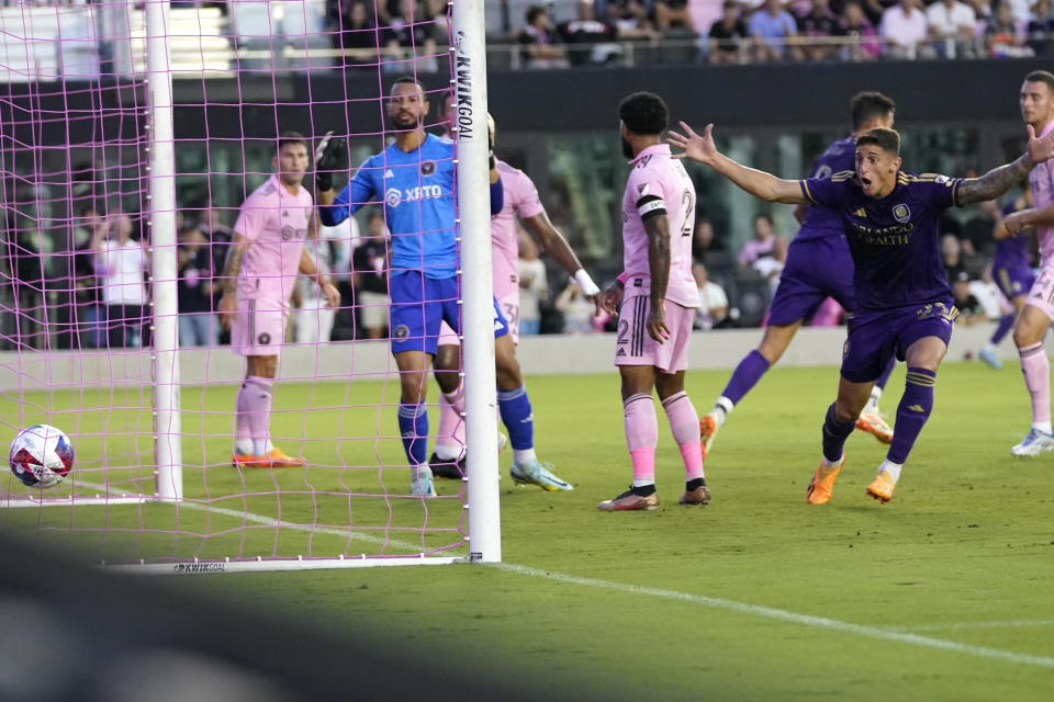 Orlando City forward Gastón González, right, reacts as the ball gets past Inter Miami goalkeeper Drake Callender, left, for a goal scored by Orlando City forward Ercan Kara, not shown, during the first half of an MLS soccer match, Saturday, May 20, 2023, in Fort Lauderdale, Fla. (AP Photo/Lynne Sladky)