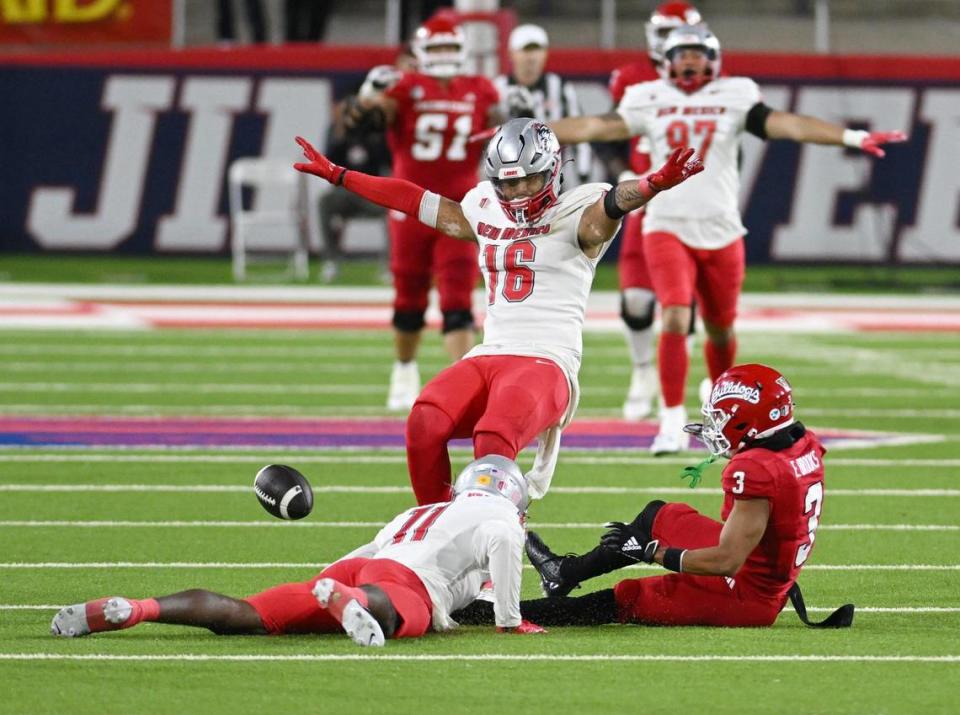 New Mexico players signal for an incomplete pass after Fresno State wideout Erik Brooks is unable to make a catch in the fourth quarter of the Bulldogs’ 25-17 loss ar Valley Children’s Stadium on Saturday, Nov. 18, 2023.