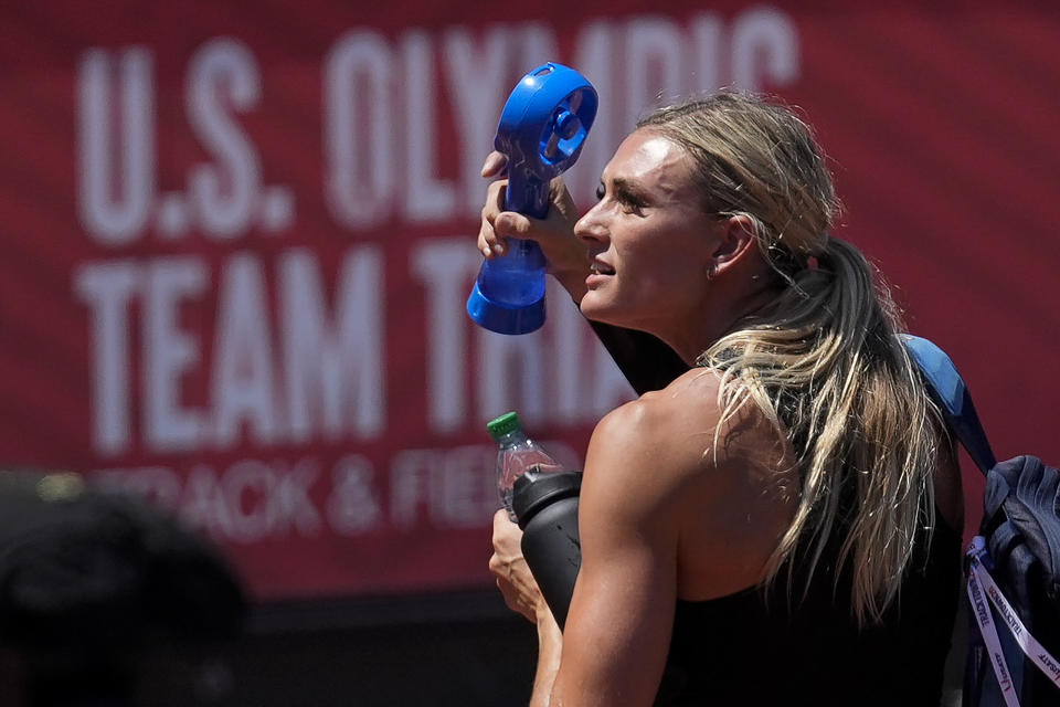 Annie Kunz cools off with a fan after the heptathlon javelin throw at the U.S. Olympic Track and Field Trials Sunday, June 27, 2021, in Eugene, Ore. (AP Photo/Ashley Landis)