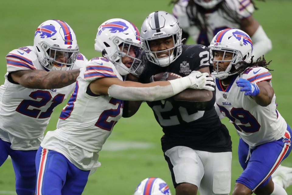 Raiders running back Josh Jacobs churning for yardage against the Bills in a 2020 game at Las Vegas.