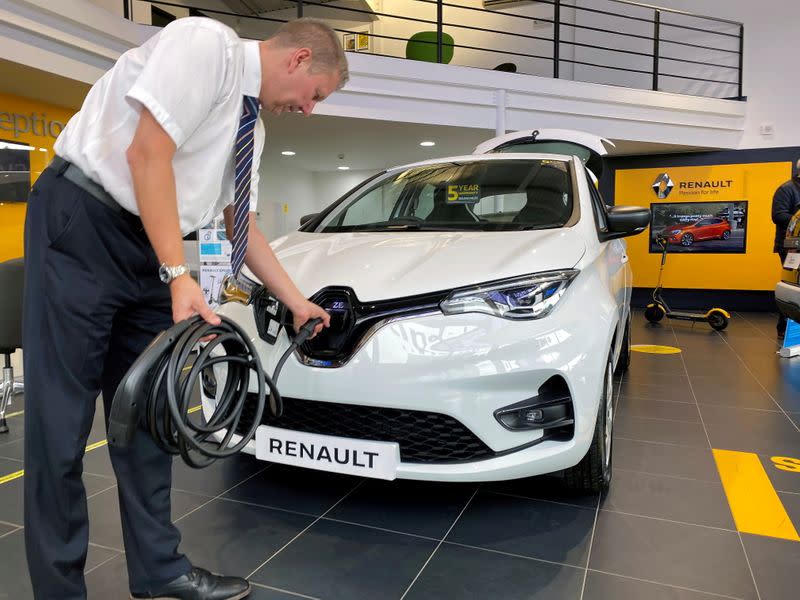 FILE PHOTO: Steve Tomlin shows the new version of Renault's small battery electric Zoe model car in Reading, Britain