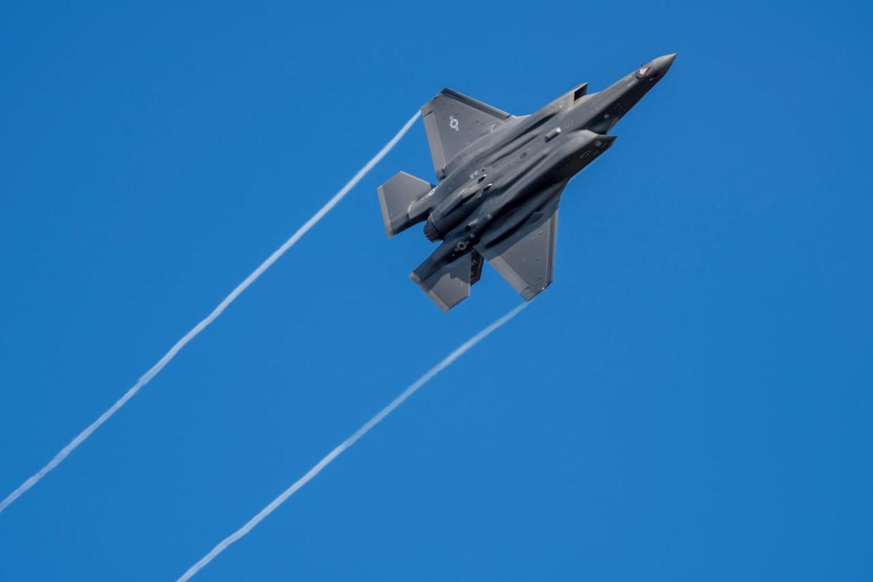 A U.S. F-35 fighter jet flies over the Eifel Mountains near Spangdahlem, Germany on Wednesday, Feb. 23, 2022. (Harald Tittel/The Associated Press - image credit)