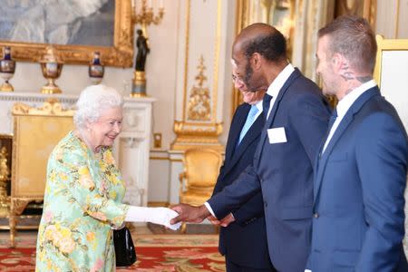 Britain's Queen Elizabeth meets John Major, Sir Lenny Henry and David Beckham at Buckingham Palace before the final Queen's Young Leaders Awards Ceremony, in London June 26, 2018. John Stillwell/Pool via Reuters