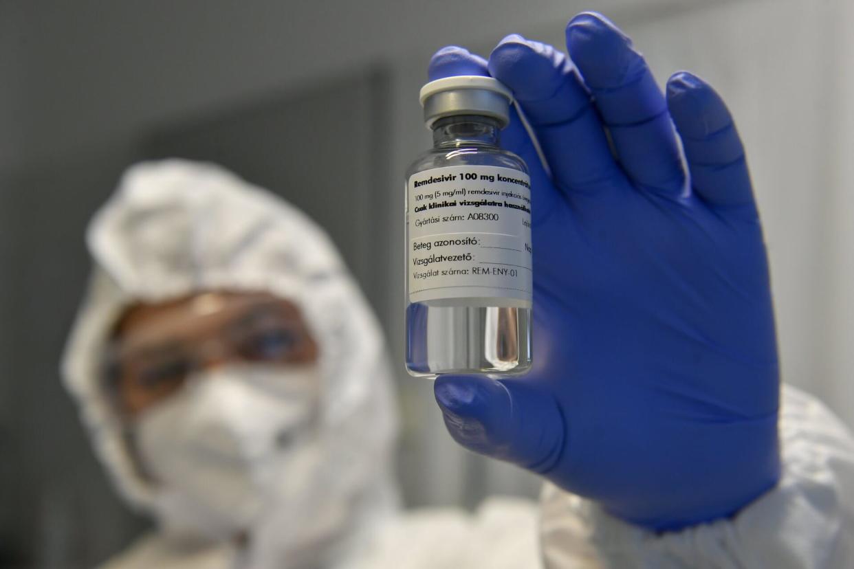 Mandatory Credit: Photo by Zsolt Czegledi/EPA-EFE/Shutterstock (10960674b)A medicine containing the agent remdesivir is shown by a health worker at the Institute of Infectology of Kenezy Gyula Teaching Hospital of the University of Debrecen in Debrecen, Hungary, 15 October 2020.