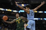 Baylor's Jalen Bridges shoots past Marquette's Oso Ighodaro during the second half of an NCAA college basketball game Tuesday, Nov. 29, 2022, in Milwaukee. (AP Photo/Morry Gash)