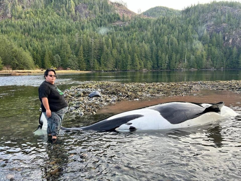 Florence Bruce, along with community members, tried to push the beached orca back into the water for over two hours but couldn't save it. (Submitted by Florence Bruce - image credit)