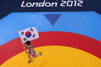 LONDON, ENGLAND - AUGUST 07: Hyeonwoo Kim of Korea celebrates his win in the Men's Greco-Roman 66 kg Wrestling on Day 11 of the London 2012 Olympic Games at ExCeL on August 7, 2012 in London, England. (Photo by Ian Walton/Getty Images)