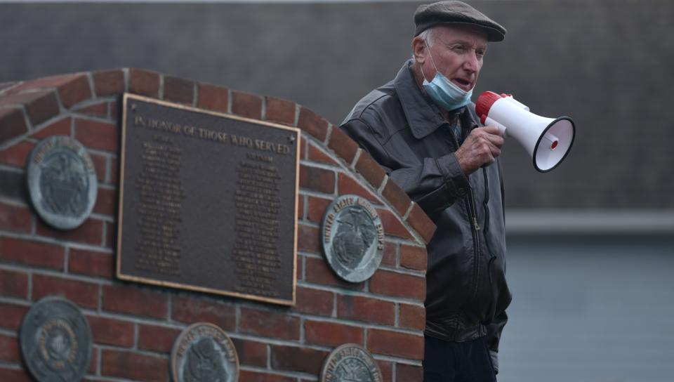 Army veteran and local historian Paul Chesbro talks to the crowd outside the Veteran's Hall on the first stop of his walking tour during 2020's Veteran's Day activities in Osterville.