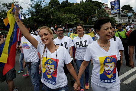 Lilian Tintori (L), wife of jailed Venezuelan opposition leader Leopoldo Lopez and her mother-in-law Antonieta Mendoza (R) arrive to a rally to demand a referendum to remove Venezuela's President Nicolas Maduro in Caracas, Venezuela October 22, 2016. REUTERS/Marco Bello