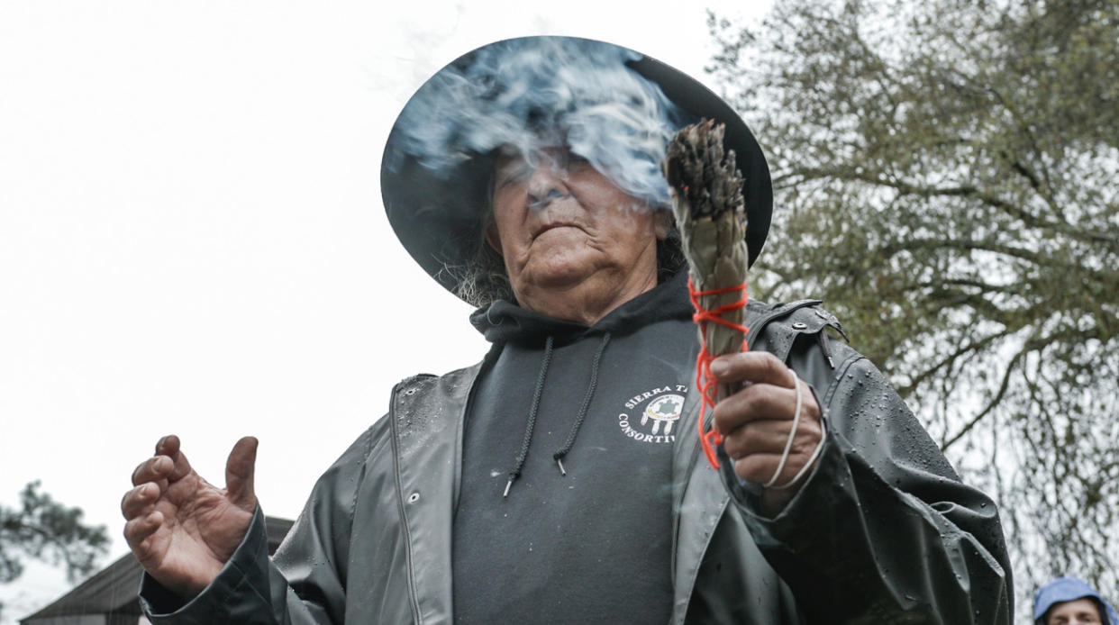 The tribe&rsquo;s spiritual leader, Keith Turner, begins burn day with a ceremony, blessing each member of the group with cleansing white sage. (Photo: Ed Kashi/VII)