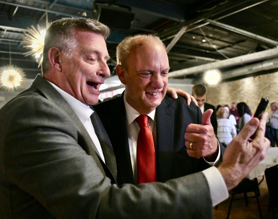 Mayor Joseph M. Petty, right, celebrates his reelection with friend and campaign supporter Rich Rafferty at El Basha Tuesday.