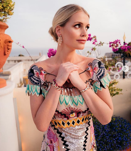 Lady Kitty Spencer poses on the mediterranean in a colourful dress