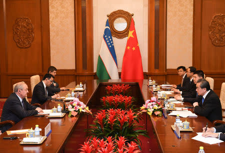 Uzbek Foreign Minister Abdulaziz Kamilov attends a meeting with Chinese State Councilor and Foreign Minister Wang Yi at the Diaoyutai State Guest House in Beijing, China, April 24, 2018. Madoka Ikegami/Pool via REUTERS