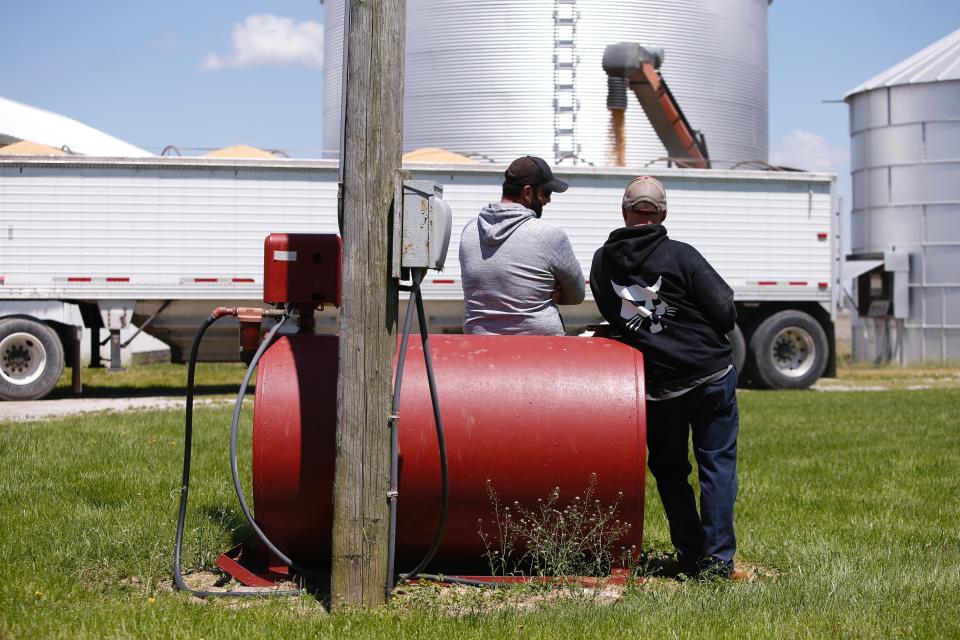 Soybean farmers watch as a truck is loaded for transport in Delaware, Ohio, on Tuesday, May 14, 2019. (Photo: AP Photo/Angie Wang)