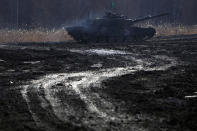 A Japanese Ground-Self Defense Force (JGDDF) Type 90 tank participates the annual drill with live ammunitions exercise at Minami Eniwa Camp Monday, Dec. 6, 2021, in Eniwa, on the northern Japan island of Hokkaido. Dozens of tanks are rolling over the next two weeks on Hokkaido, a main military stronghold for a country with perhaps the world's most little known yet powerful army. (AP Photo/Eugene Hoshiko)