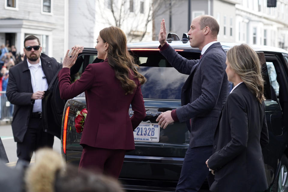 Britain's Prince William and Kate, Princess of Wales wave to onlookers following a visit to Greentown Labs, Thursday, Dec. 1, 2022, in Somerville, Mass. (AP Photo/Mary Schwalm)