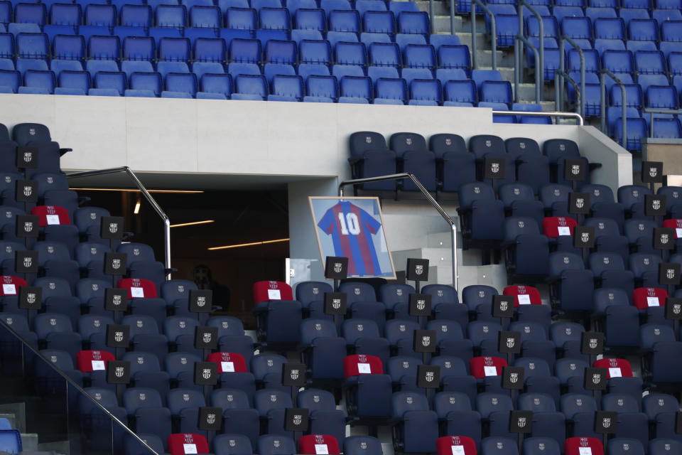 A FC Barcelona jersey autographed by Diego Maradona is displayed in memory of soccer legend Diego Armando Maradona ahead of the Spanish La Liga soccer match between FC Barcelona and Osasuna at the Camp Nou stadium in Barcelona, Spain, Sunday, Nov. 29, 2020. (AP Photo/Joan Monfort)