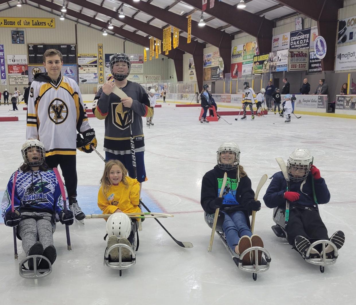 Jacksyn Wirkus, back row left side, and Weston Brink; Keirra Rudebusch, front row left side, Kadynce Ohman, Keira Henman, Brynn Eitreim and David Johnson getting some ice time at the Watertown Ice Arena.