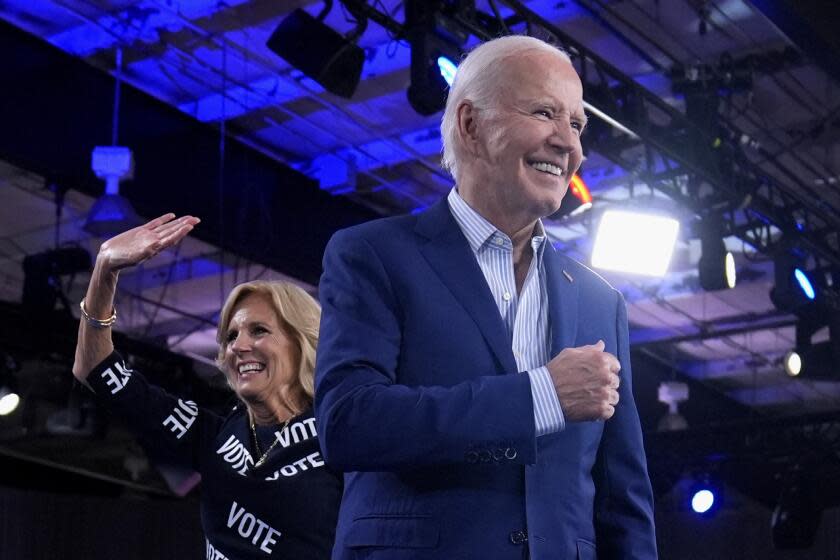 President Joe Biden, right, and first lady Jill Biden walk off stage after speaking at a campaign rally, Friday, June 28, 2024, in Raleigh, N.C. (AP Photo/Evan Vucci)