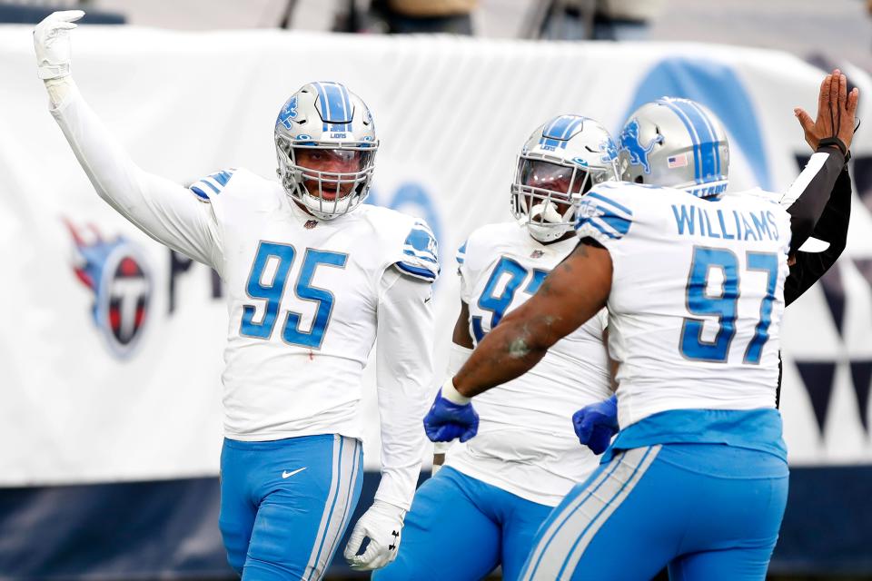 Defensive end Romeo Okwara (95) of the Detroit Lions celebrates with teammates after sacking Ryan Tannehill #17 of the Tennessee Titans (not pictured) in the end zone for a safety during the second quarter of the game  at Nissan Stadium on Dec. 20, 2020 in Nashville, Tennessee.