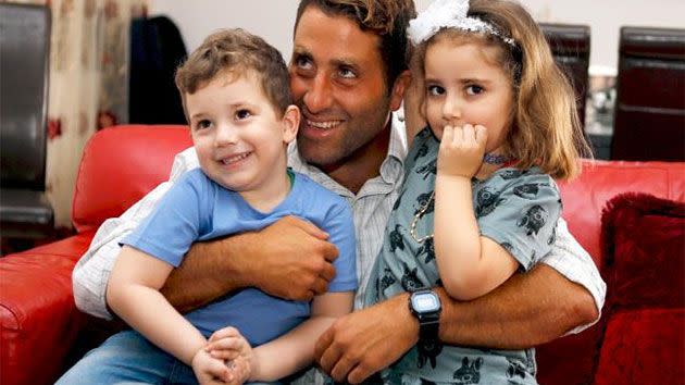 Noah and Lahela al-Amin with their father Ali Elamine. Photo: Reuters