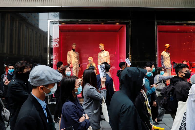 Anti-government protesters take part at a lunchtime protest in Hong Kong