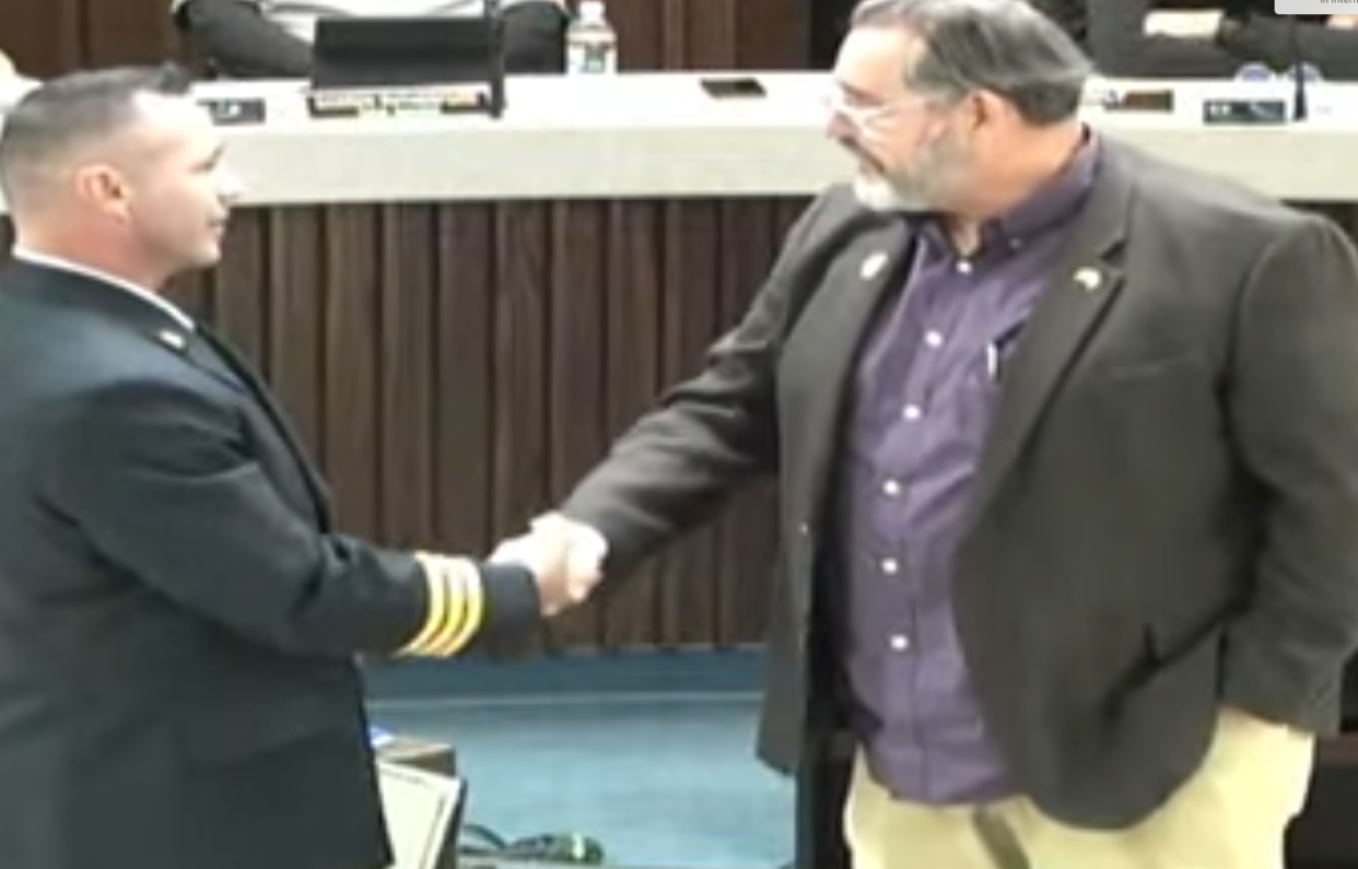 At left is SFD Batt. Chief Scott Killgore. Oklahoma Municipal League (OML) Vice President Ray Poland awarded Killgore for 25 years of service to the City of Shawnee This week.