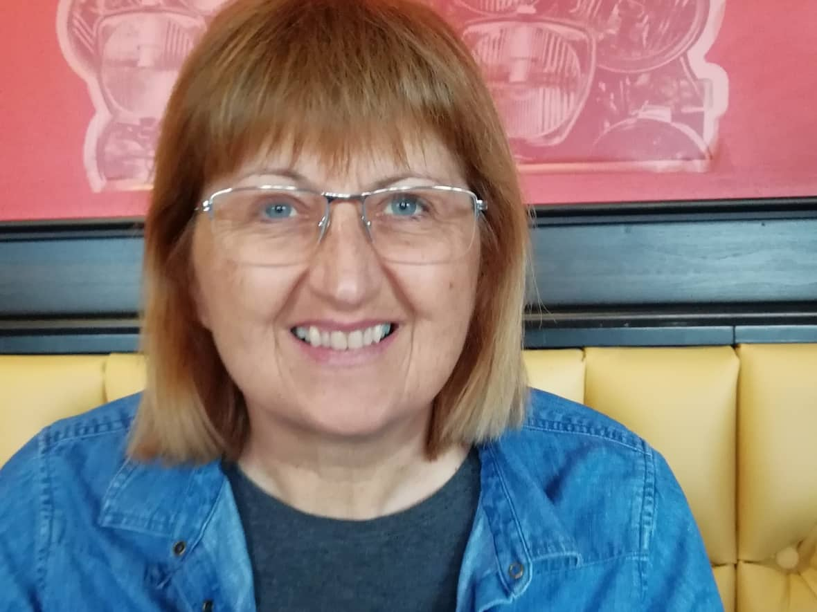 Heidi Gatherall is all smiles at the first in-person meeting of her book club in almost two years.  (Aisha Elgayar - image credit)