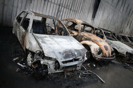 Burnt vehicles are seen after a forest fire in Miro, near Penacova, Portugal, October 17, 2017. REUTERS/Pedro Nunes