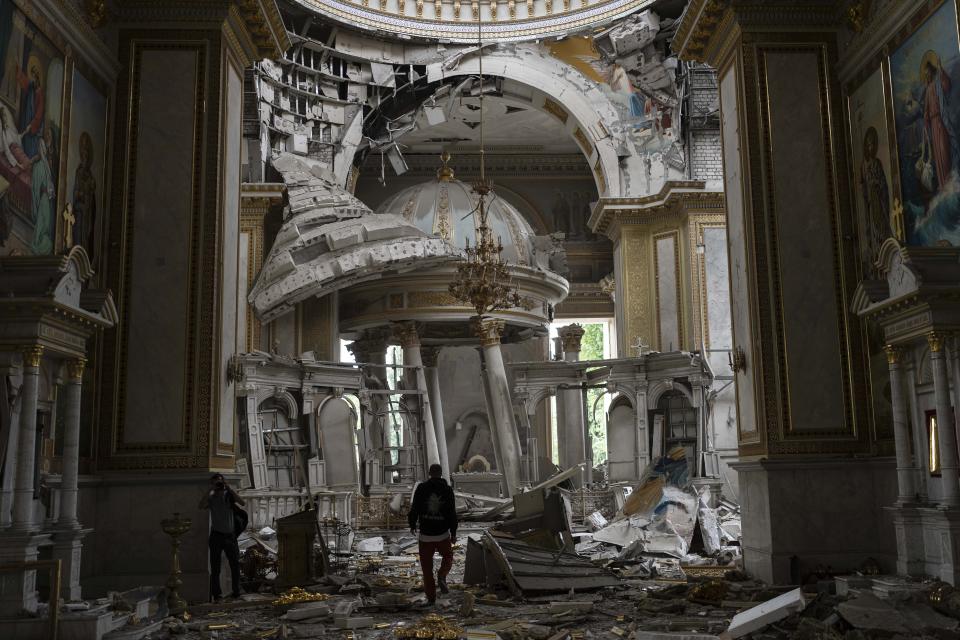 FILE - Church personnel inspect damage inside the Odesa Transfiguration Cathedral in Odesa, Ukraine, Sunday, July 23, 2023, following Russian missile attacks. (AP Photo/Jae C. Hong, File)