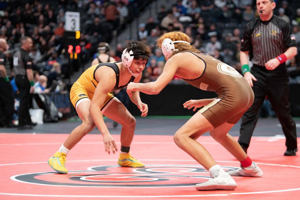 Pueblo East's  Manuel "Pocky" Amaro faces off against Billy Rodriguez of Thomas Jefferson during their 113-pound first round matchup in the Class 4A state tournament at Ball Arena on Thursday, Feb. 16, 2023.