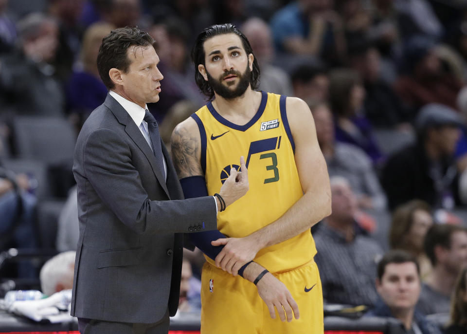 Utah Jazz coach Quin Snyder talks with guard Ricky Rubio during the team’s NBA game against the Sacramento Kings. (AP Photo/Rich Pedroncelli)