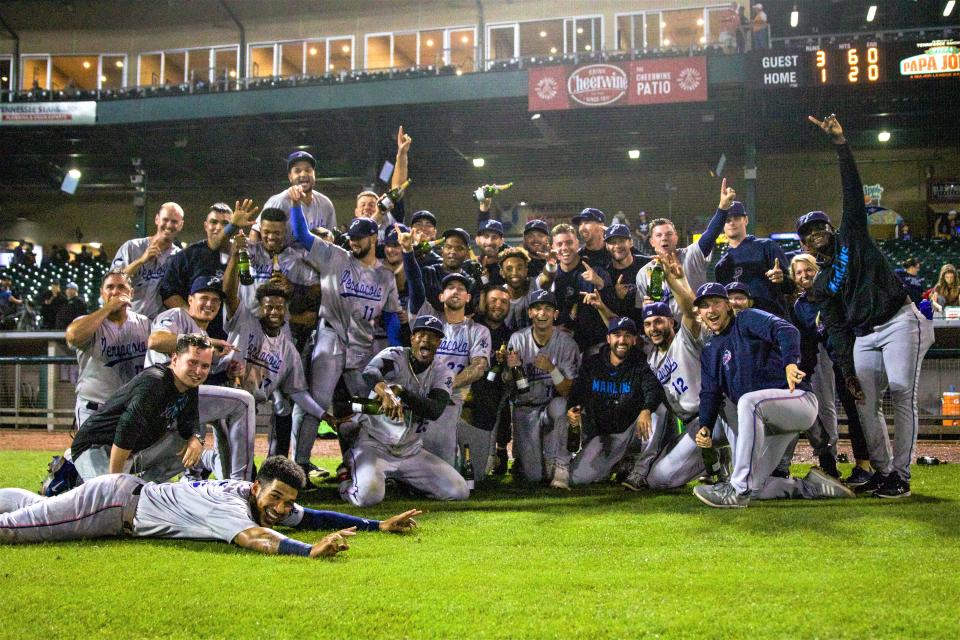 The Blue Wahoos celebrate winning the Southern League South Division first half in Biloxi earlier this season to qualify for the playoffs again.
