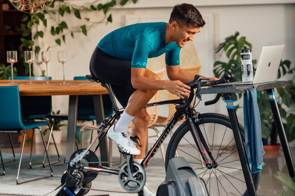 Image shows rider exercising indoors.