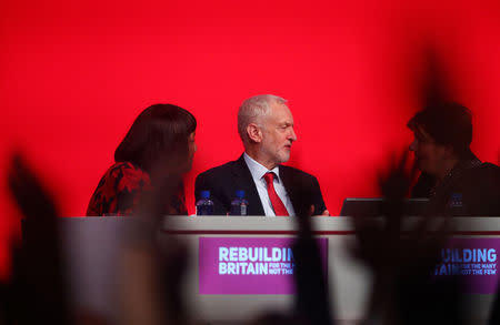 Delegates vote on the Labour Party's Brexit policy as party leader Jeremy Corbyn, Shadow Foreign Secretarty Emily Thornberry and Diane Abbott, the Shadow Home Secretary sit on the podium at the party's conference in Liverpool, Britain, September 25, 2018. REUTERS/Hannah McKay