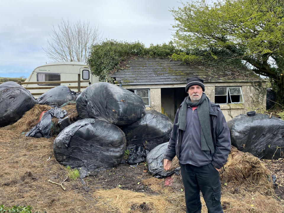 Squatter Neil Parker has been living on the land in Wales for a year after claiming it was 'abandoned'. (SWNS)