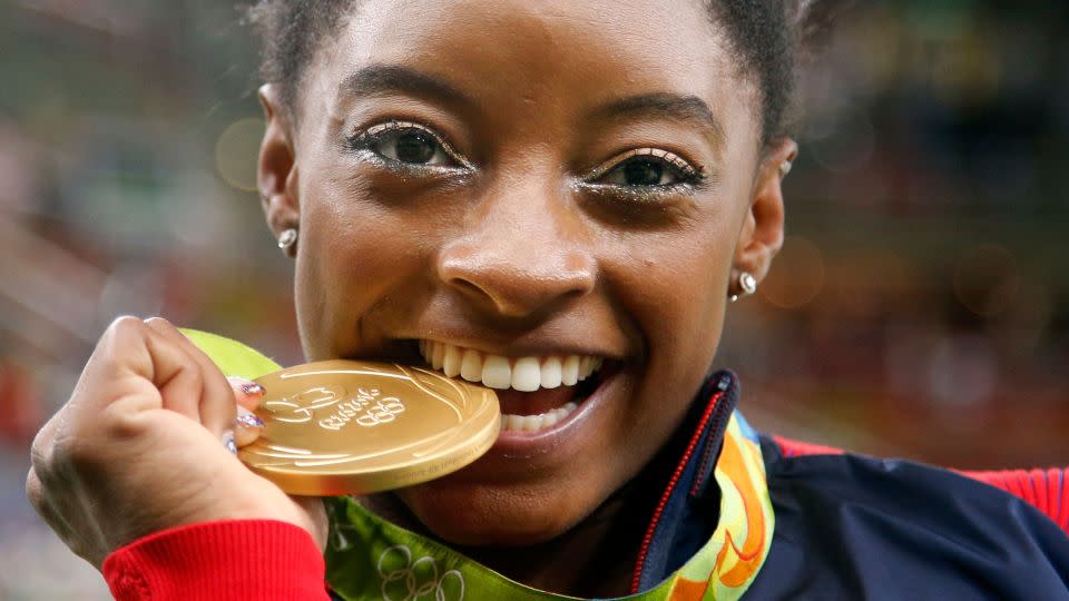 Biles dazzled crowds at the 2016 Rio Olympics, earning five medals, including four golds. - Dmitri Lovetsky/AP